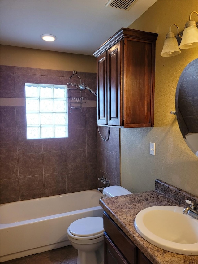 full bath with tile patterned floors, shower / washtub combination, visible vents, toilet, and vanity