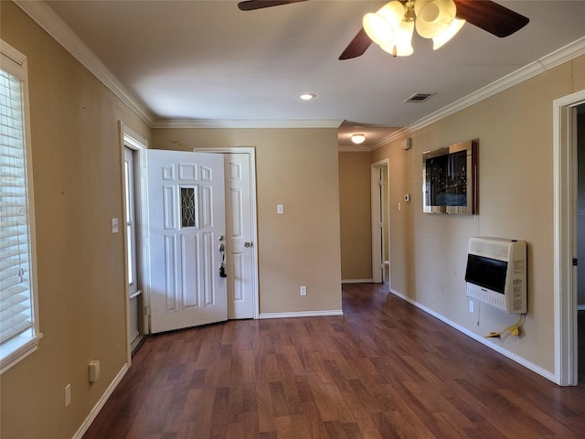 entrance foyer featuring visible vents, heating unit, wood finished floors, ceiling fan, and ornamental molding