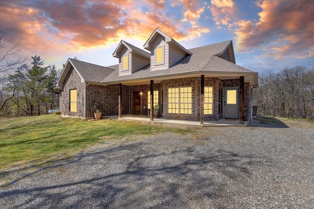 372 Private Road 123, Savoy, TX 75479 - view of front of property with brick siding, a front lawn, and roof with shingles