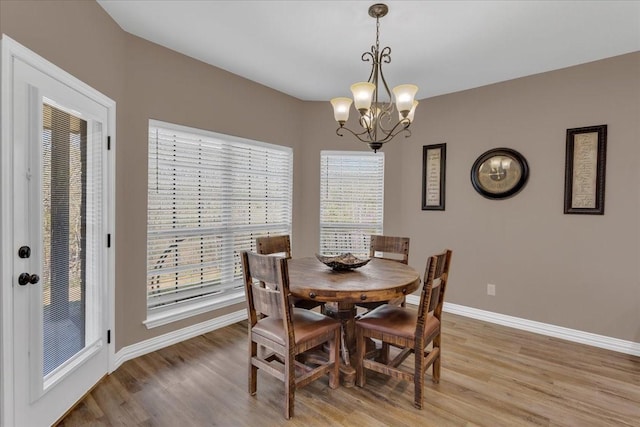 372 Private Road 123, Savoy, TX 75479 - dining area with baseboards, light wood-style floors, and a notable chandelier
