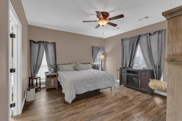 372 Private Road 123, Savoy, TX 75479 - bedroom featuring visible vents, multiple windows, and wood finished floors