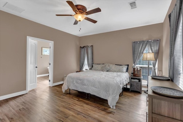 372 Private Road 123, Savoy, TX 75479 - bedroom with multiple windows, visible vents, and wood finished floors