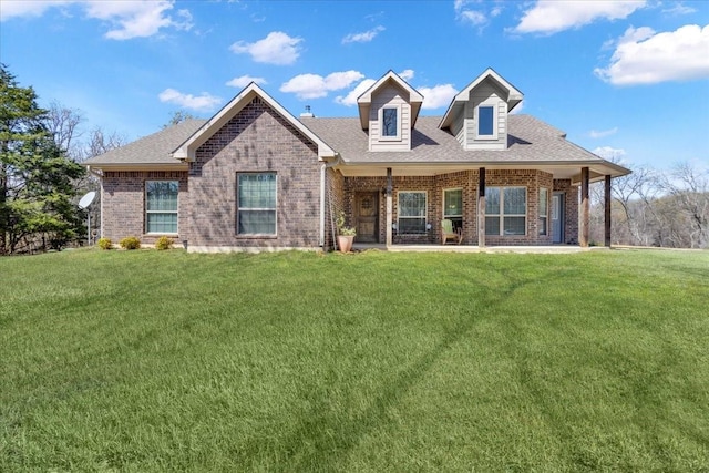 372 Private Road 123, Savoy, TX 75479 - view of front facade featuring brick siding, a shingled roof, and a front lawn