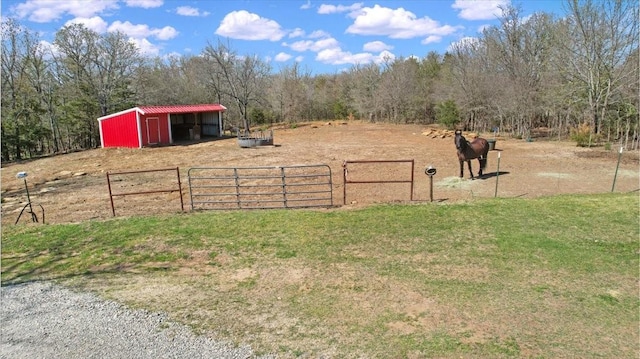 372 Private Road 123, Savoy, TX 75479 - view of yard featuring an outdoor structure, a pole building, a wooded view, and fence