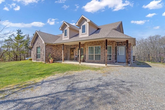 372 Private Road 123, Savoy, TX 75479 - view of front of property with brick siding, a shingled roof, and a front lawn