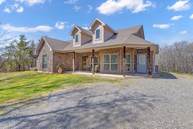372 Private Road 123, Savoy, TX 75479 - view of front of property with a front lawn, brick siding, and roof with shingles