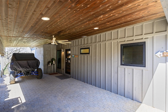 exterior space featuring ceiling fan