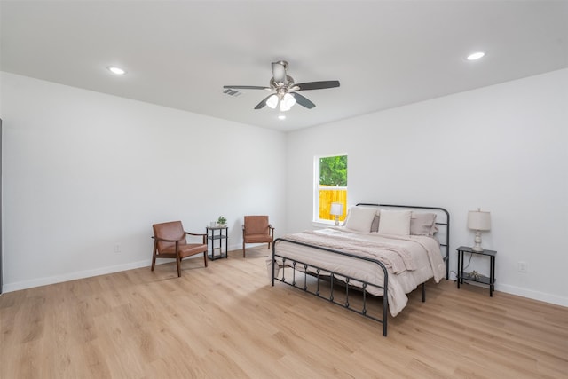 bedroom featuring light wood-type flooring, baseboards, visible vents, and recessed lighting