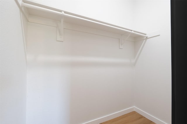 spacious closet with light wood-style floors