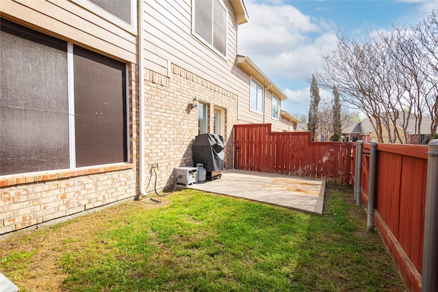 view of yard with a patio and a fenced backyard