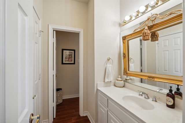 7388 Wilderness Way, Weatherford, TX 76085 - bathroom with vanity, baseboards, and wood finished floors