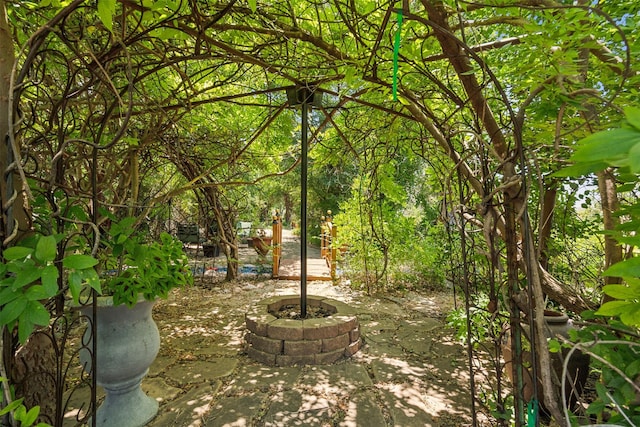 7388 Wilderness Way, Weatherford, TX 76085 - view of yard with an outdoor fire pit and a patio