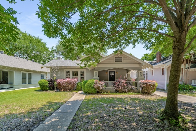 422 S Winnetka Ave, Dallas, TX 75208 - view of front of property with a porch and a front yard