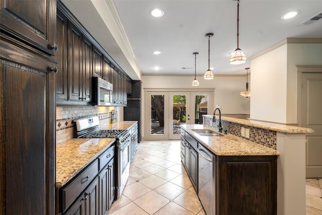 422 S Winnetka Ave, Dallas, TX 75208 - kitchen with a sink, stainless steel appliances, crown molding, decorative backsplash, and a kitchen island with sink