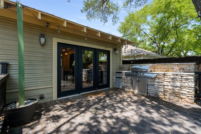 422 S Winnetka Ave, Dallas, TX 75208 - wooden terrace featuring an outdoor kitchen, a grill, french doors, and a patio area