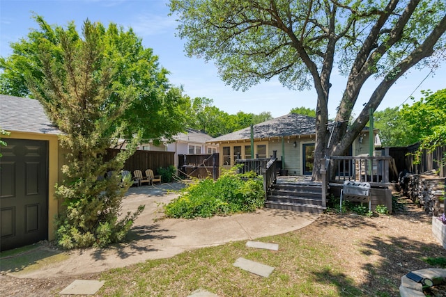 422 S Winnetka Ave, Dallas, TX 75208 - rear view of property featuring a wooden deck and fence