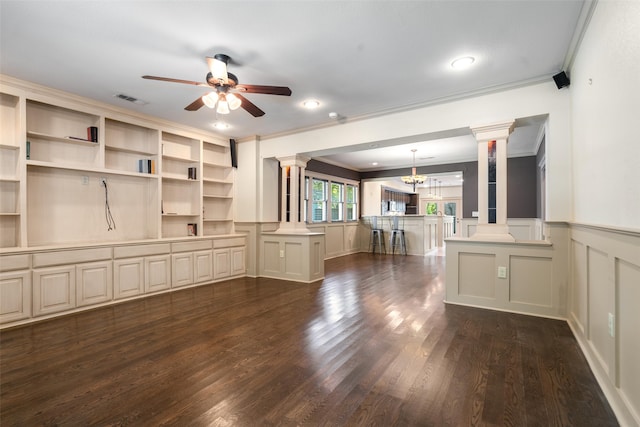 422 S Winnetka Ave, Dallas, TX 75208 - unfurnished living room featuring decorative columns, crown molding, a decorative wall, ceiling fan, and a wainscoted wall