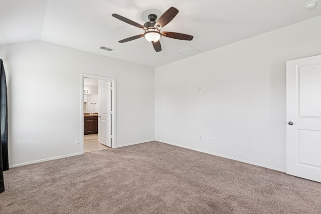 10004 Huntersville Trl, Fort Worth, TX 76108 - unfurnished bedroom with light colored carpet, vaulted ceiling, baseboards, ensuite bathroom, and a ceiling fan