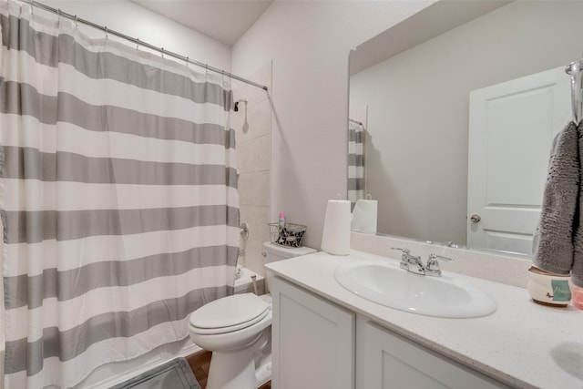 bathroom with toilet and vanity