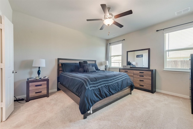 bedroom with baseboards, carpet floors, and visible vents