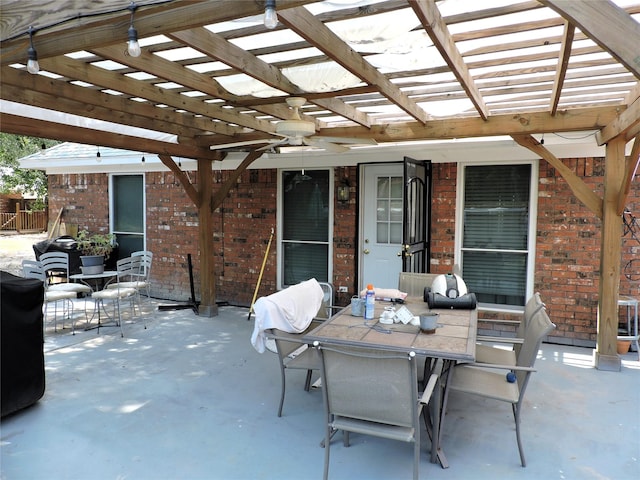 view of patio / terrace featuring outdoor dining space and a pergola