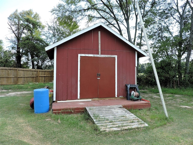 view of shed with fence