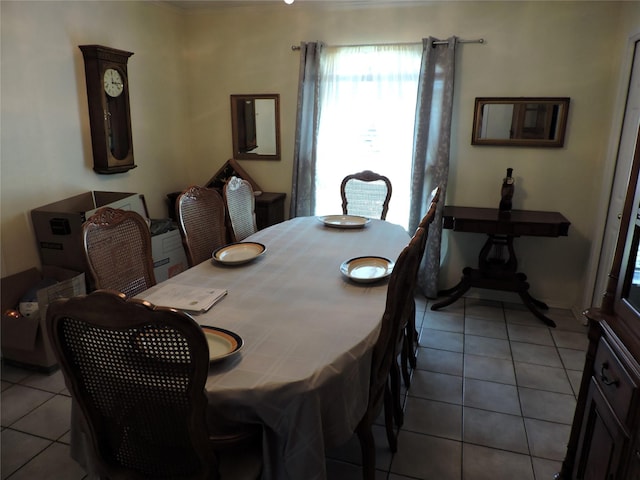 dining area with light tile patterned floors