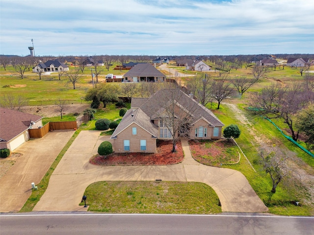 birds eye view of property with a residential view