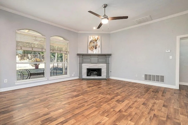 4726 Steeple Chase Ln, Rockwall, TX 75032 - unfurnished living room with wood finished floors, a ceiling fan, a fireplace, and crown molding