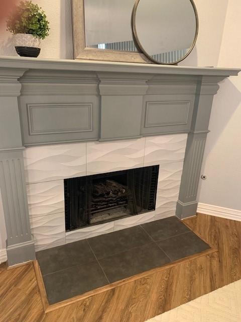 4726 Steeple Chase Ln, Rockwall, TX 75032 - detailed view of a fireplace with flush hearth and wood finished floors