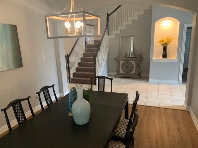 4726 Steeple Chase Ln, Rockwall, TX 75032 - dining room featuring stairway, a chandelier, and wood finished floors