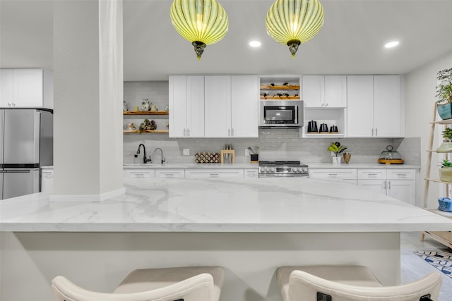 kitchen with decorative backsplash, stainless steel appliances, and open shelves