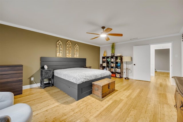 bedroom with crown molding and light wood-type flooring