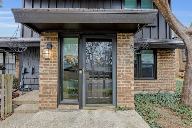 entrance to property with brick siding