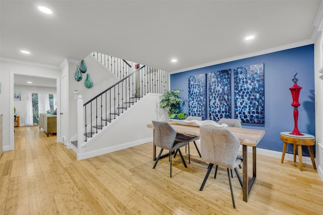 dining room with stairs, crown molding, light wood finished floors, baseboards, and recessed lighting