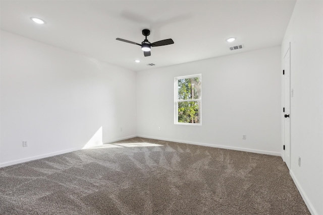spare room with recessed lighting, carpet, baseboards, visible vents, and a ceiling fan