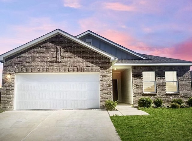 1637 Escondido Dr, Fort Worth, TX 76052 - ranch-style home featuring concrete driveway, board and batten siding, brick siding, a garage, and a yard
