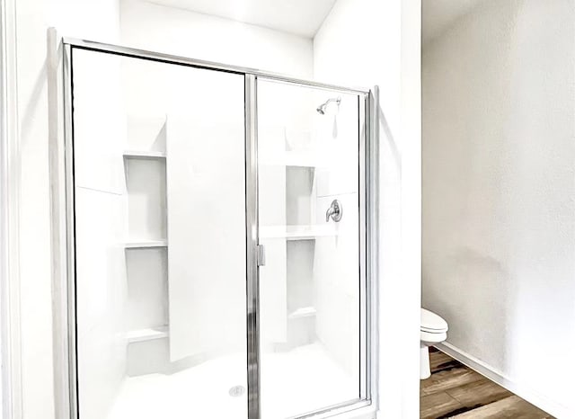 1637 Escondido Dr, Fort Worth, TX 76052 - full bath with toilet, a stall shower, and wood finished floors