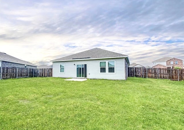 1637 Escondido Dr, Fort Worth, TX 76052 - back of house featuring a fenced backyard, a shingled roof, and a yard