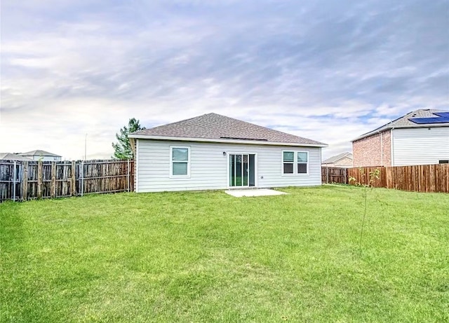 1637 Escondido Dr, Fort Worth, TX 76052 - back of house featuring a shingled roof, a fenced backyard, and a yard