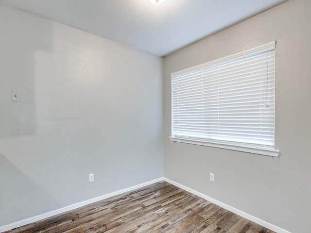 1122 Millview Dr Unit 1504, Arlington, TX 76012 - spare room featuring baseboards and wood finished floors