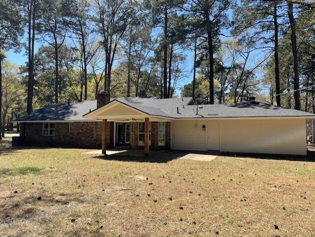 3841 Meyers St, Shreveport, LA 71119 - unfurnished living room featuring a ceiling fan, dark wood-style flooring, baseboards, and french doors