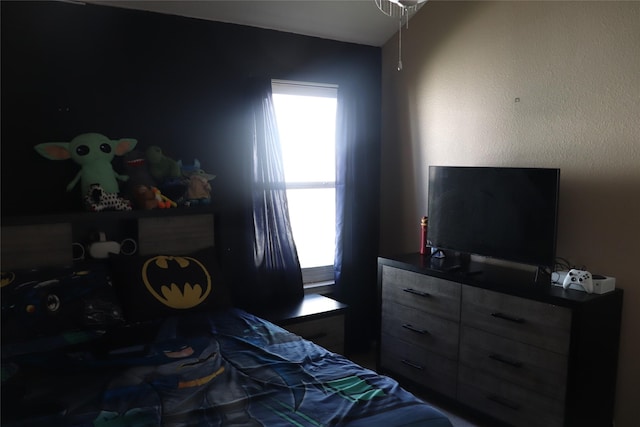 bedroom with multiple windows