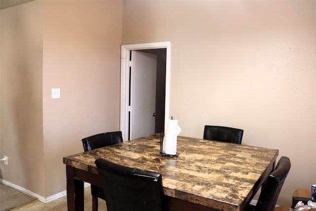 dining space featuring baseboards