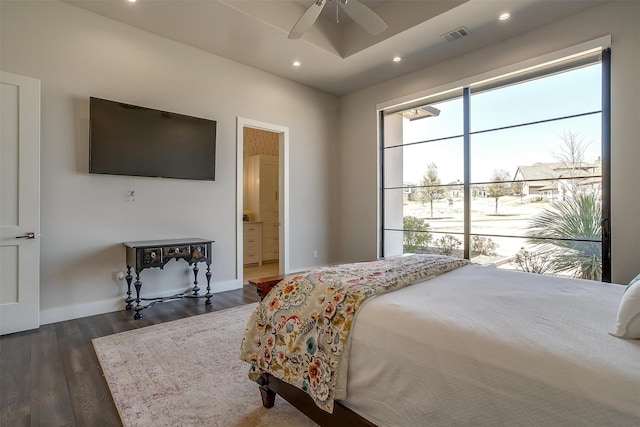 bedroom with recessed lighting, dark wood-style floors, ensuite bathroom, a ceiling fan, and visible vents