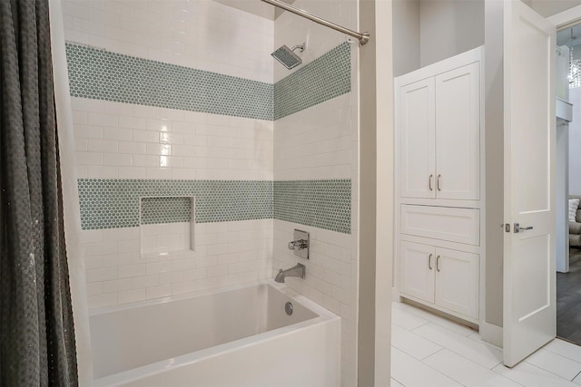bathroom featuring shower / bath combo and tile patterned floors