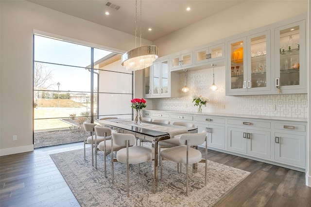 dining room featuring baseboards, dark wood-style floors, visible vents, and recessed lighting