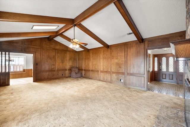 1611 Royal Mile Ct, Arlington, TX 76015 - unfurnished living room with carpet floors, wood walls, and a ceiling fan