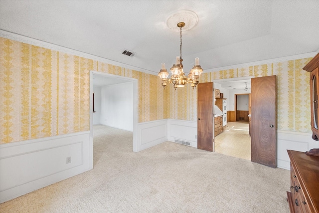 1611 Royal Mile Ct, Arlington, TX 76015 - carpeted spare room featuring wallpapered walls, a chandelier, and a wainscoted wall