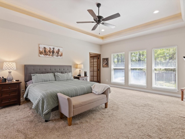 141 County Road 3481, Paradise, TX 76073 - bedroom featuring a tray ceiling, recessed lighting, light colored carpet, and multiple windows
